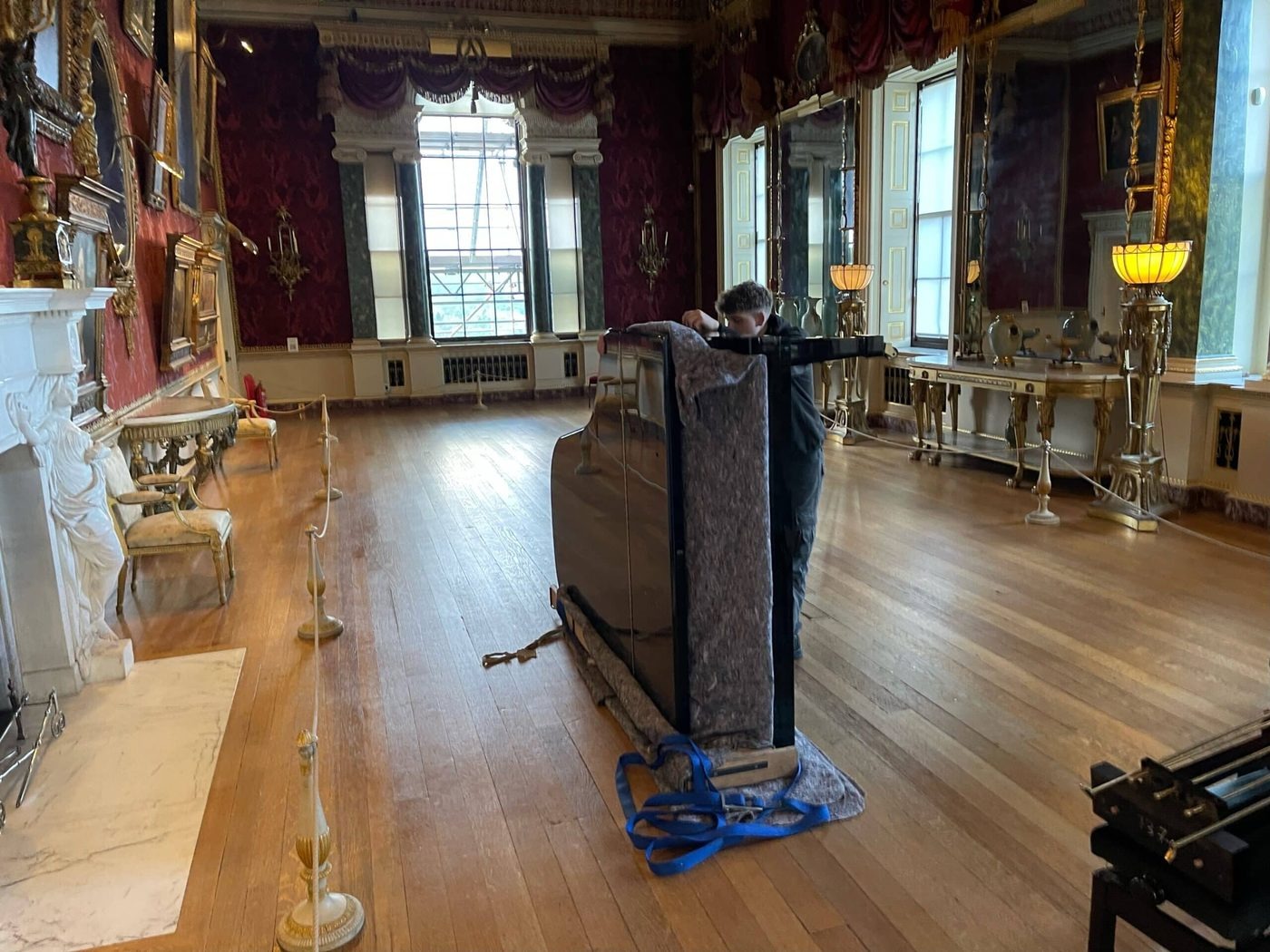 Grand piano wrapped and moved through a grand Leeds interior